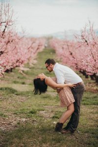 Cute couple engagement poses cherry blossoms boise engagement photographer