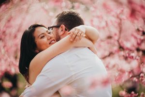 Cute couple engagement poses cherry blossoms boise engagement photographer
